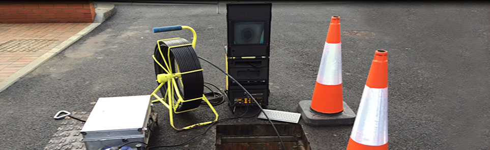 CCTV drain survey equipment set up over an open manhole